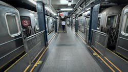 subway barriers on either side in underground MTA subway station subway barriers on either side in underground MTA subway station