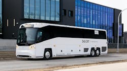 a D45 CRT motorcoach parks on an empty street a D45 CRT motorcoach parks on an empty street