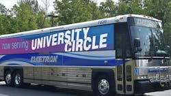 a laketran commuter bus with a now serving university circle bus wrap a laketran commuter bus with a now serving university circle bus wrap