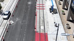 a transit only lane painted in red on the right side of the street in an aerial view a transit only lane painted in red on the right side of the street in an aerial view