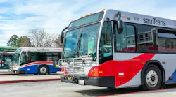 Two SamTrans busses parked at a transit depot in Redwood City, Calif.