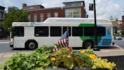 a CNG-powered LANTA-branded bus drives down a town street a CNG-powered LANTA-branded bus drives down a town street