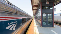 An Amtrak train sits at an elevated platform in Springfield, Mass.