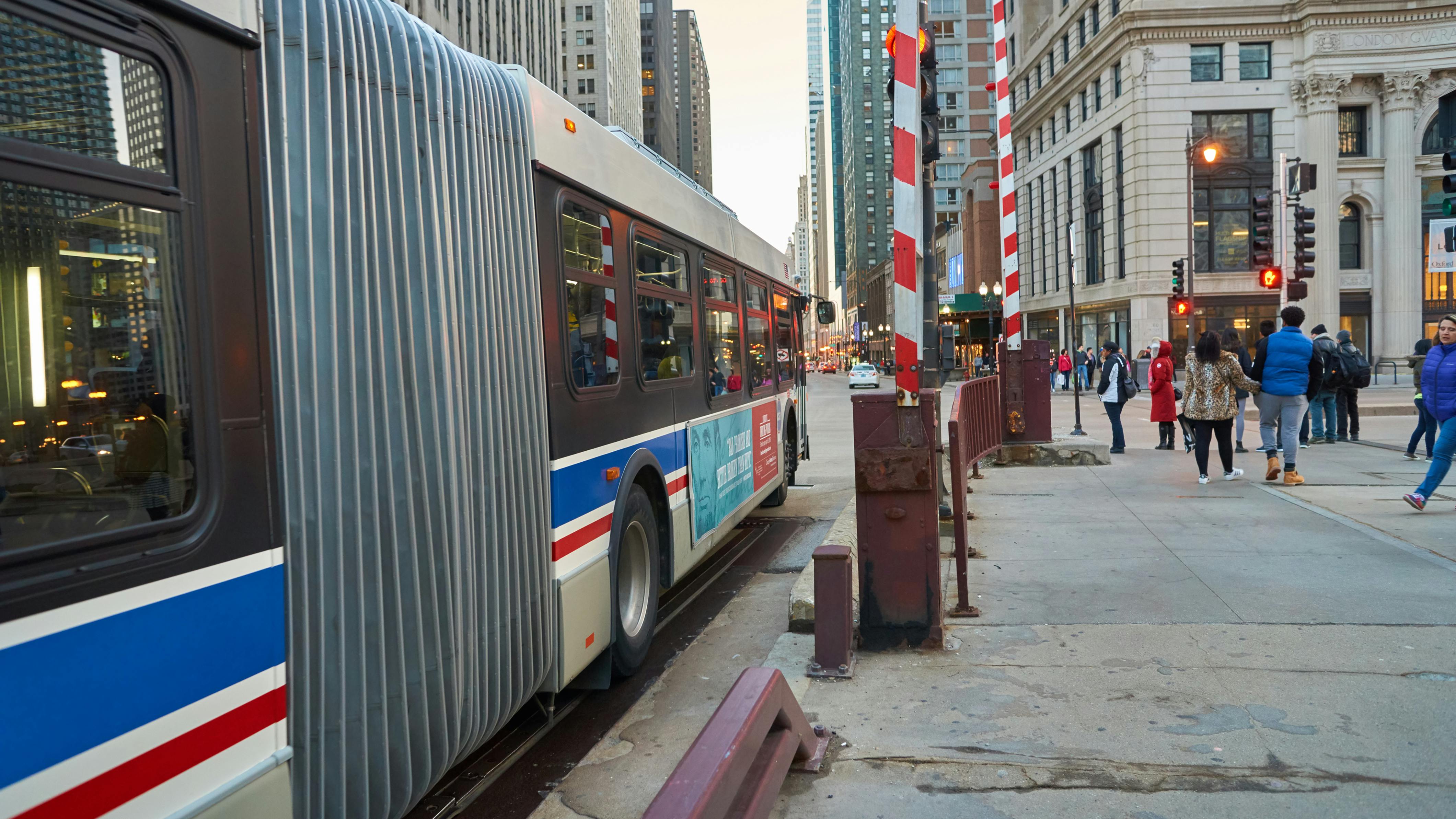 A CTA bus sits at a bus stop.