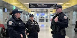 Three RTD-PD officers stand together in a transit station. Three RTD-PD officers stand together in a transit station.