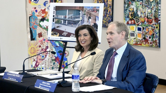 Gov. Kathy Hochul sits next to MTA Chair and CEO Janna Lieber during a board meeting