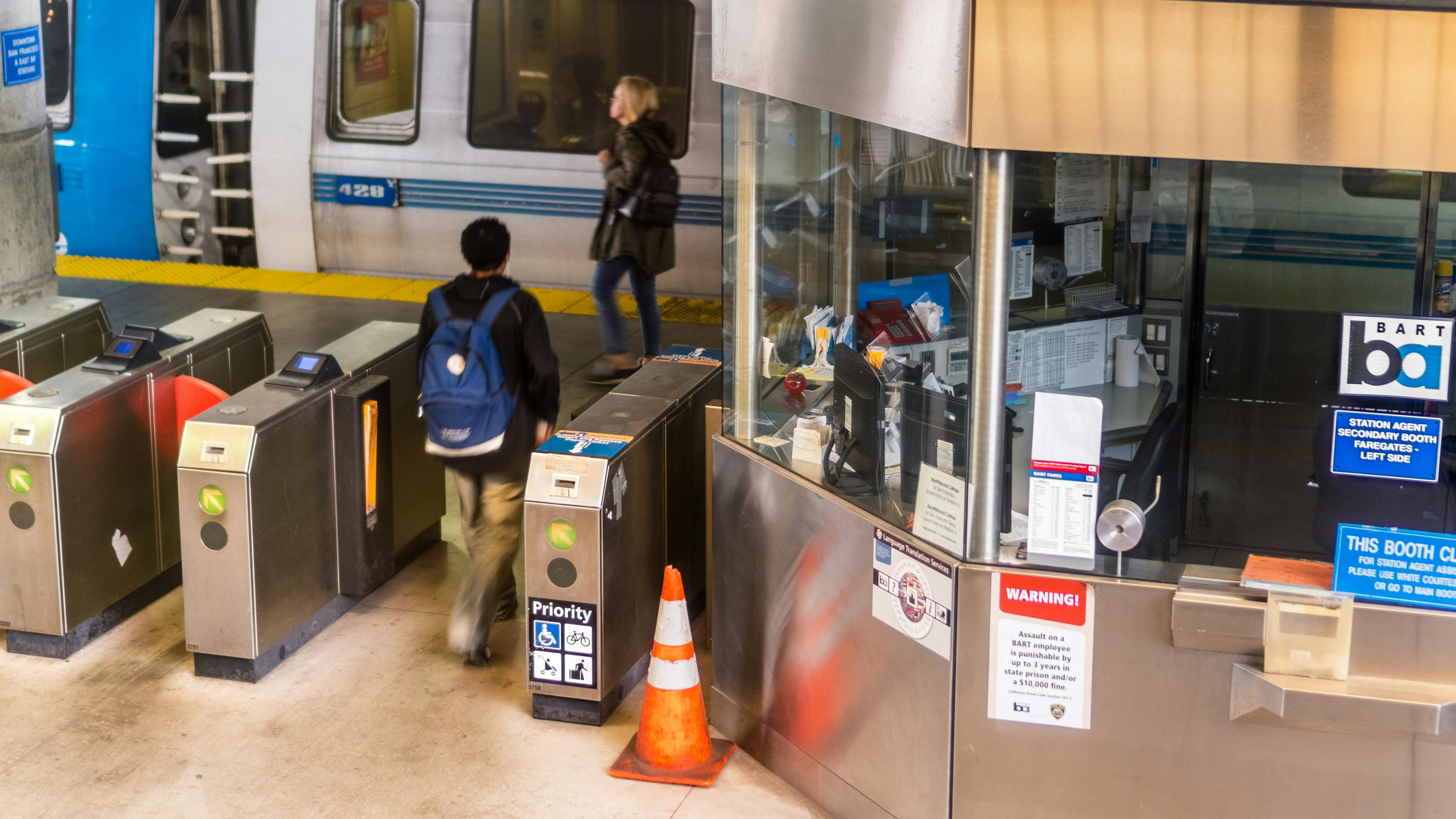 A BART station entrance featuring payment terminals.