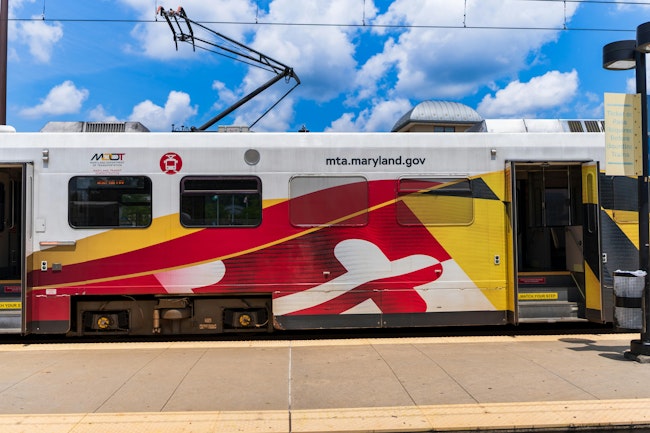 A Maryland Transit Authority train sits at a station.