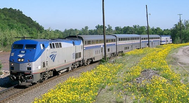 The Heartland Flyer train travels down the track.