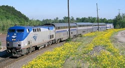 The Heartland Flyer train travels down the track. The Heartland Flyer train travels down the track.
