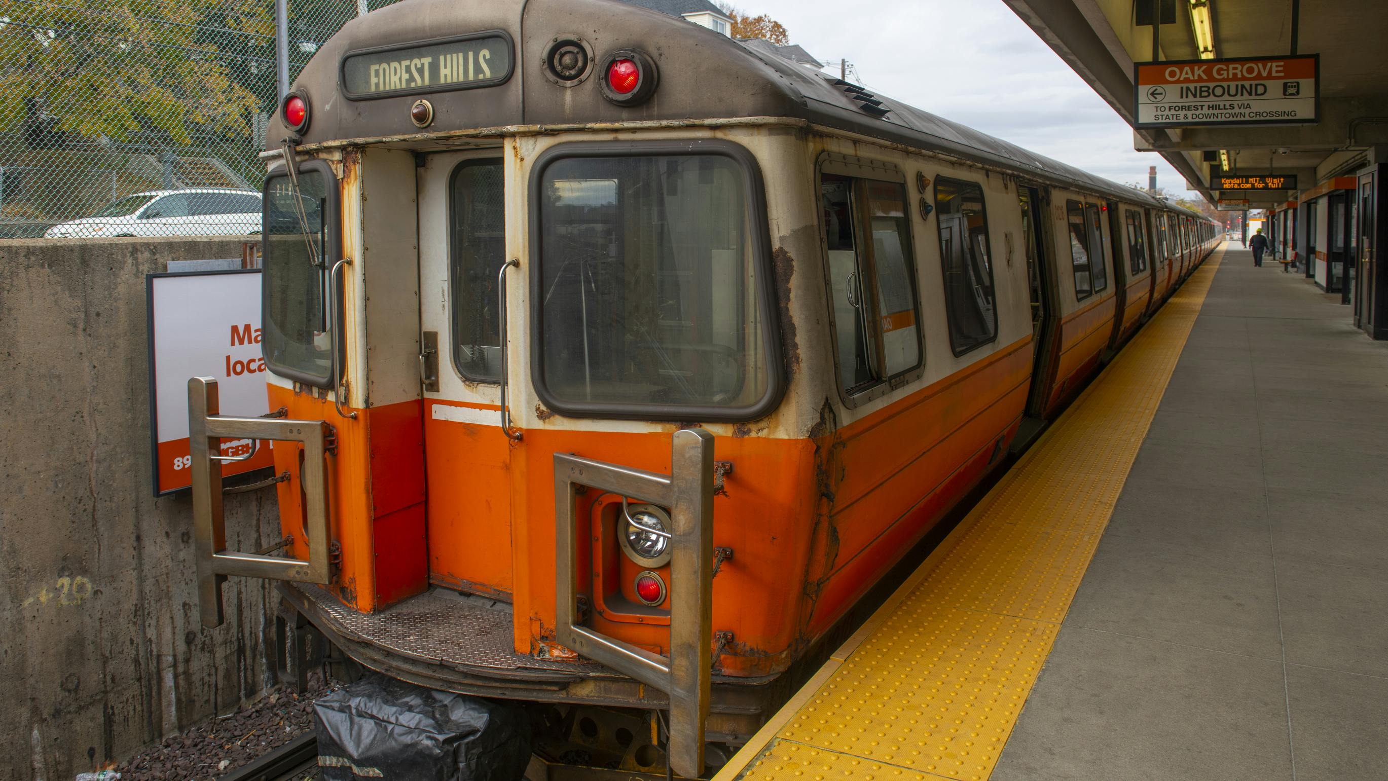 A Massachusetts Bay Transportation Authority Orange Line train stops at Oak Grove Station in Malden, Mass.