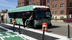 DDOT bus stays in traffic lane as people board from new elevated platform. DDOT bus stays in traffic lane as people board from new elevated platform.