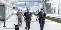 Denver Regional Transportation District police officers with a K-9. Denver Regional Transportation District police officers with a K-9.
