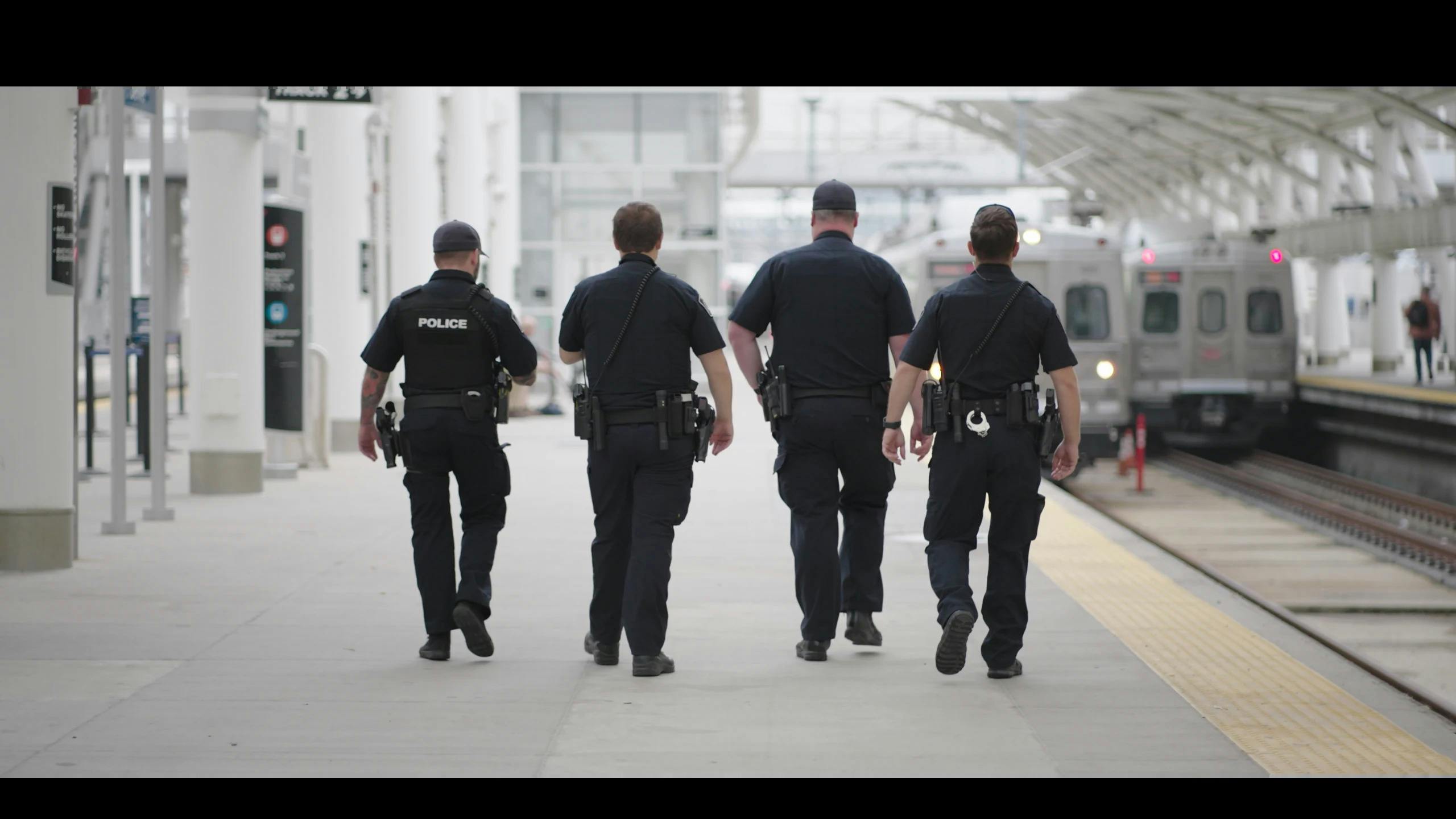 A back view of Denver Regional Transportation District police officers.