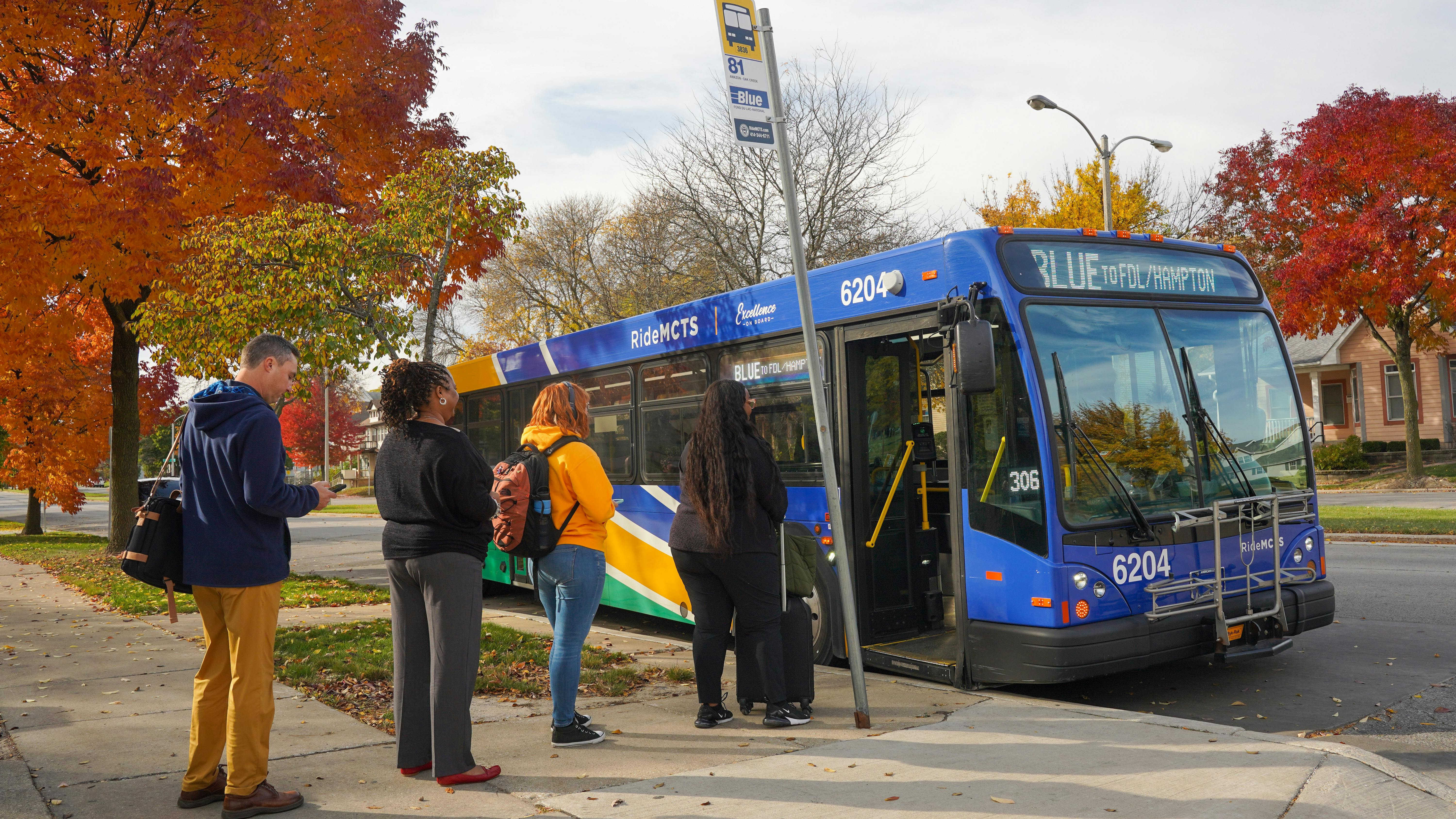 Passengers enter a new GILLIG clean diesel bus.