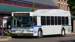 An LTD bus makes a stop. An LTD bus makes a stop.