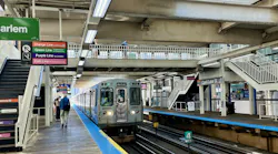 Passengers walk to in incoming subway train.