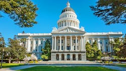 The image shows the California State Capitol building. The image shows the California State Capitol building.