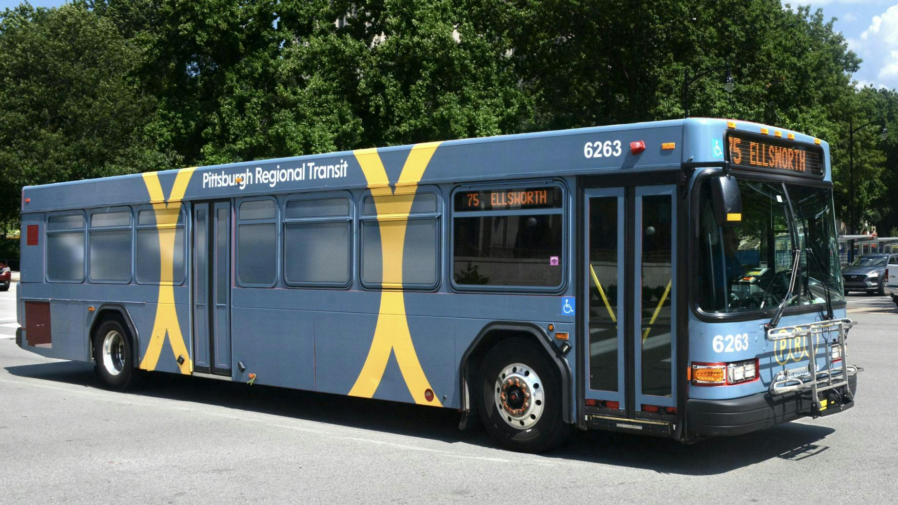 The image shows a PRT bus in waiting.