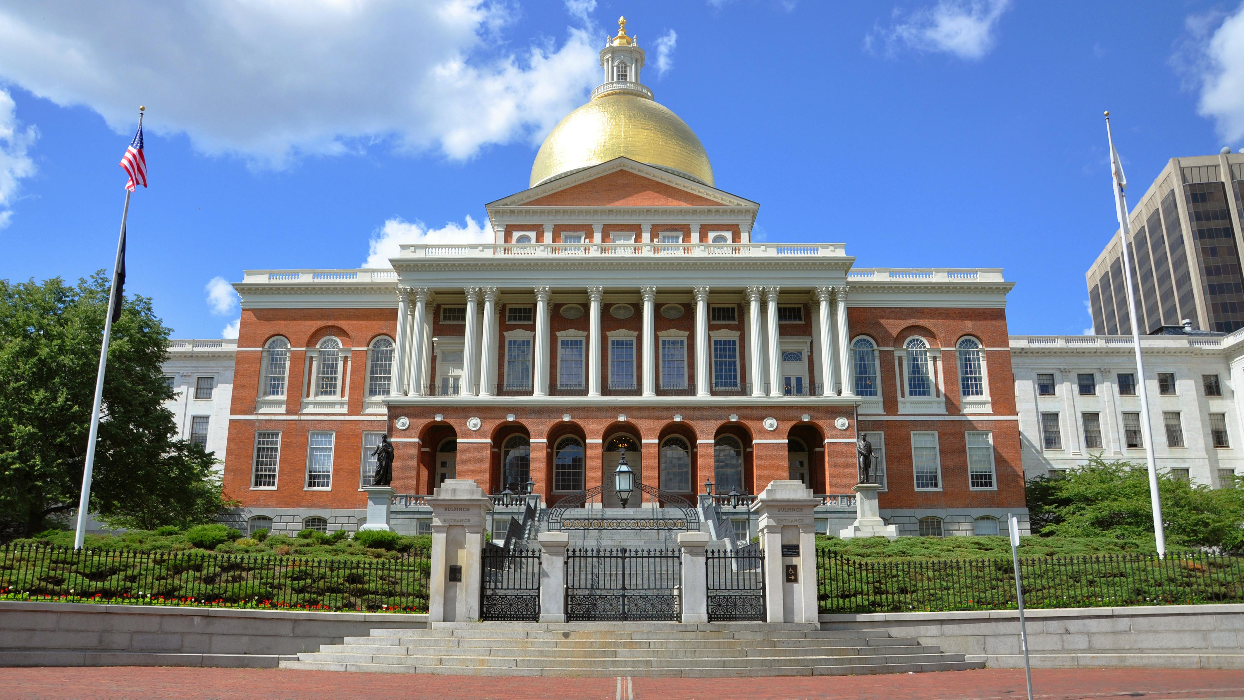 The image displays the Massachusetts state house.