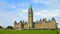 The image displays the Canadian Parliament Hill. The image displays the Canadian Parliament Hill.