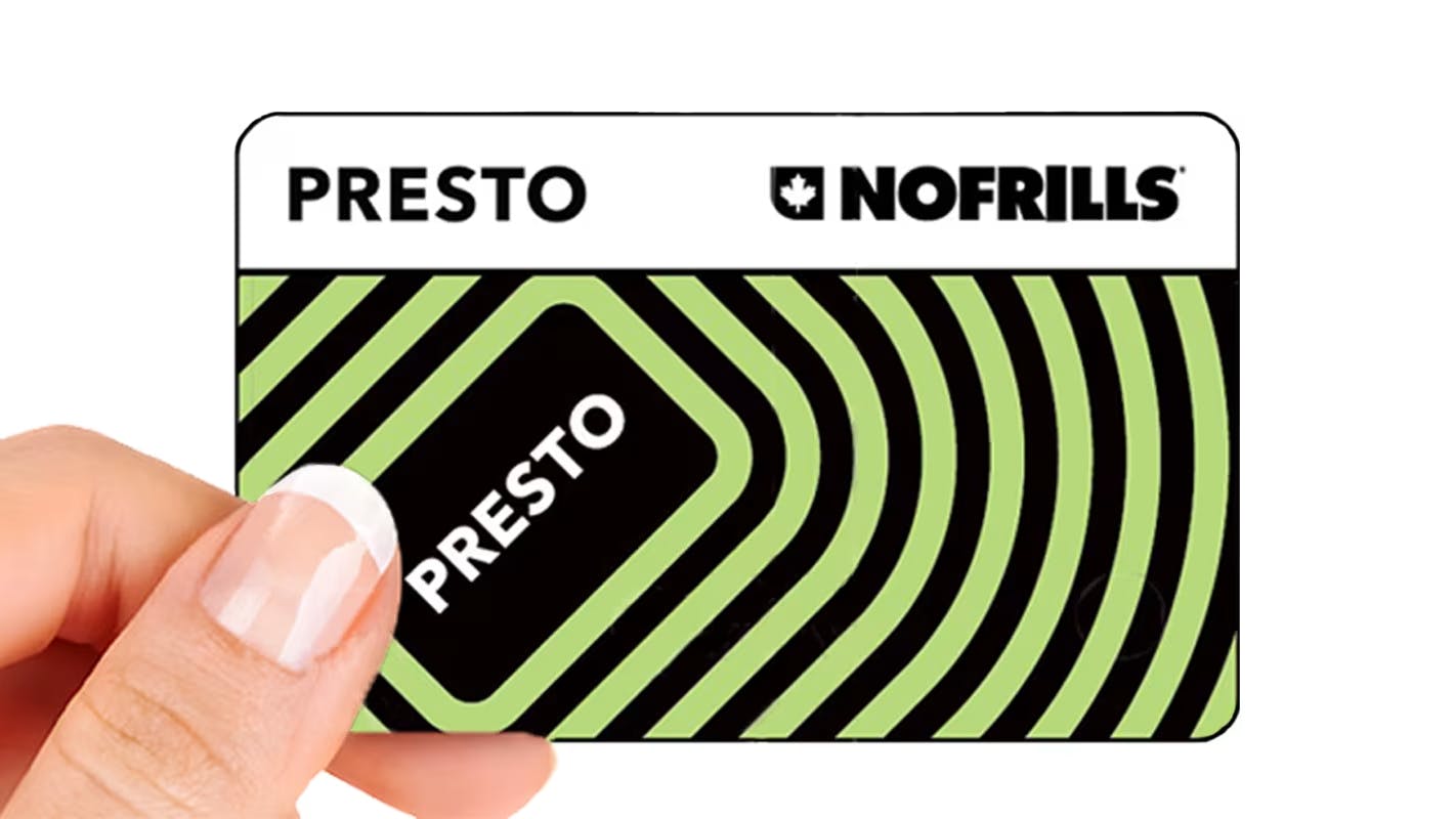 The image displays a hand holding the limited edition No Frills PRESTO card.
