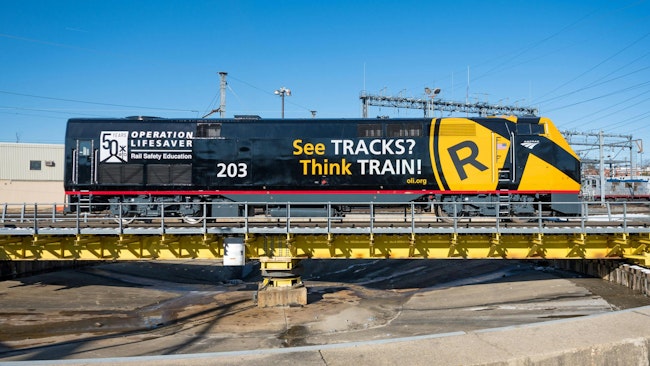 An Amtrak train wrapped with promotion of Operation Lifesaver's See Tracks? Think Train® Week.