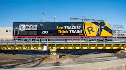 An Amtrak train wrapped with promotion of Operation Lifesaver's See Tracks? Think Train® Week.