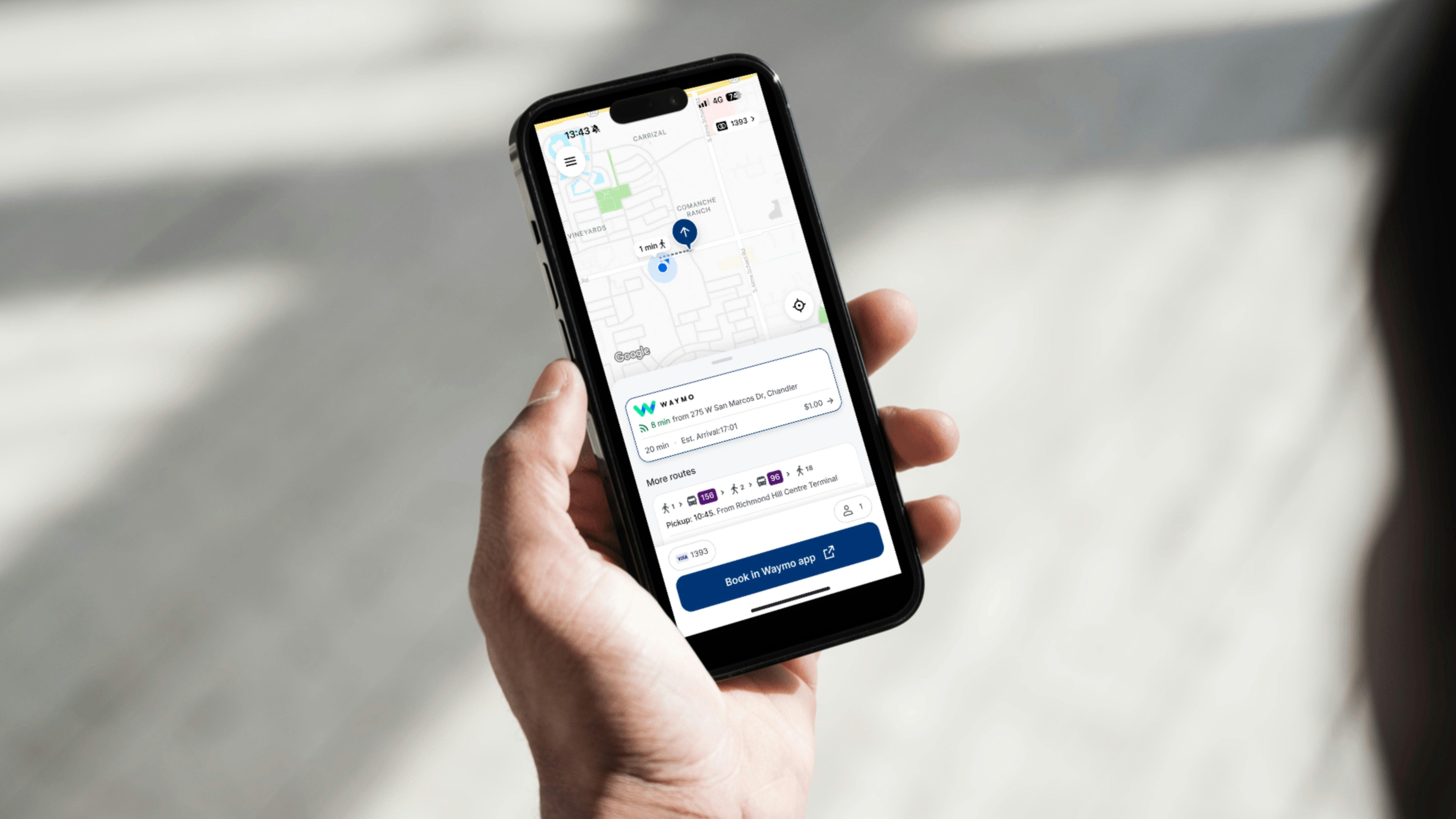An iPhone displays the Chandler Flex app offering a Waymo ride.