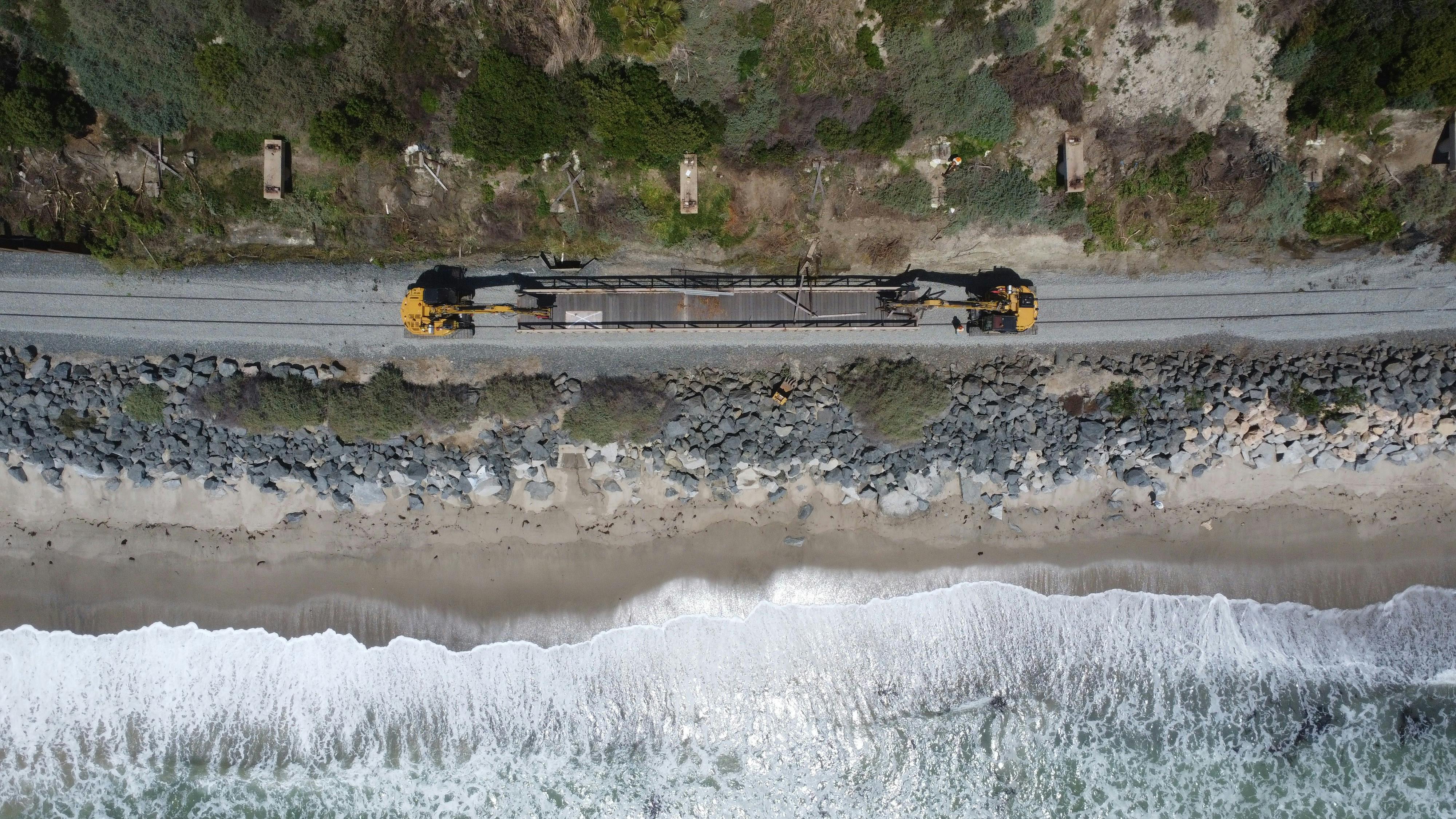 An overhead shot of a train traveling along the LOSSAN coastal rail line.