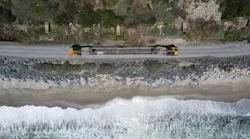 An overhead shot of a train traveling along the LOSSAN coastal rail line.