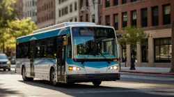 electric bus drives down street
