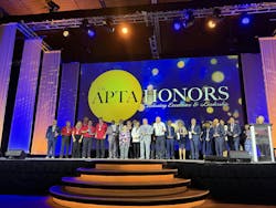 The image displays the APTA Honors award winners on the ballroom stage. The image displays the APTA Honors award winners on the ballroom stage.