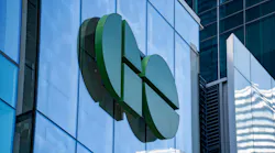 The GO Transit logo on a building facade.