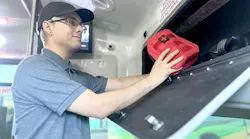 The image displays a man stocks a VVTA vehicle with NARCAN.
