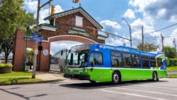 A Rochester RTS bus drives down a street. A Rochester RTS bus drives down a street.
