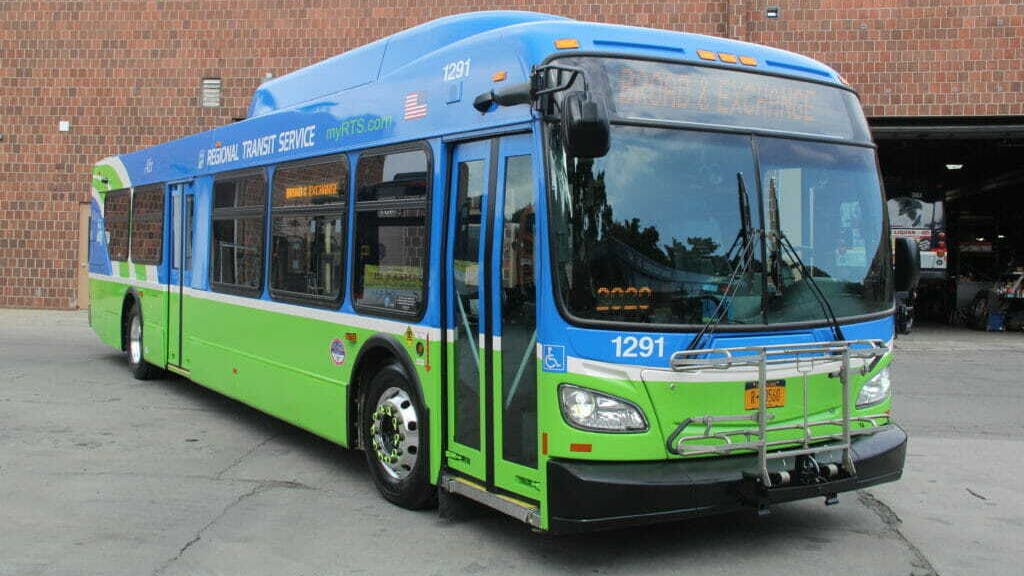 An RTS bus sits parked in a lot.