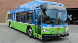 An RTS bus sits parked in a lot.