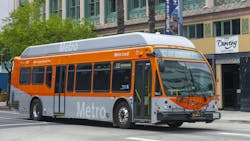 The image shows a L.A. Metro bus driving down a street. The image shows a L.A. Metro bus driving down a street.