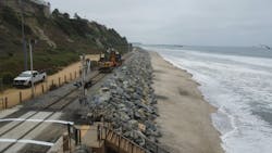 Workers clean up the coastal rail line. Workers clean up the coastal rail line.