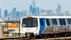 A BART train moves down the track.