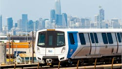 A BART train moves down the track. A BART train moves down the track.