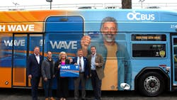 Orange County Transportation Authority Board Members and staff get a first look at the Wave card and a bus wrapped with the Wave logo to promote the new program after a Board of Directors meeting on Monday, Oct. 13. Orange County Transportation Authority Board Members and staff get a first look at the Wave card and a bus wrapped with the Wave logo to promote the new program after a Board of Directors meeting on Monday, Oct. 13.