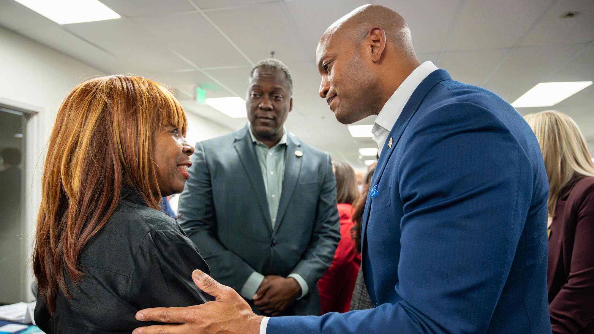Maryland Governor Wes Moore shakes a woman's hand.