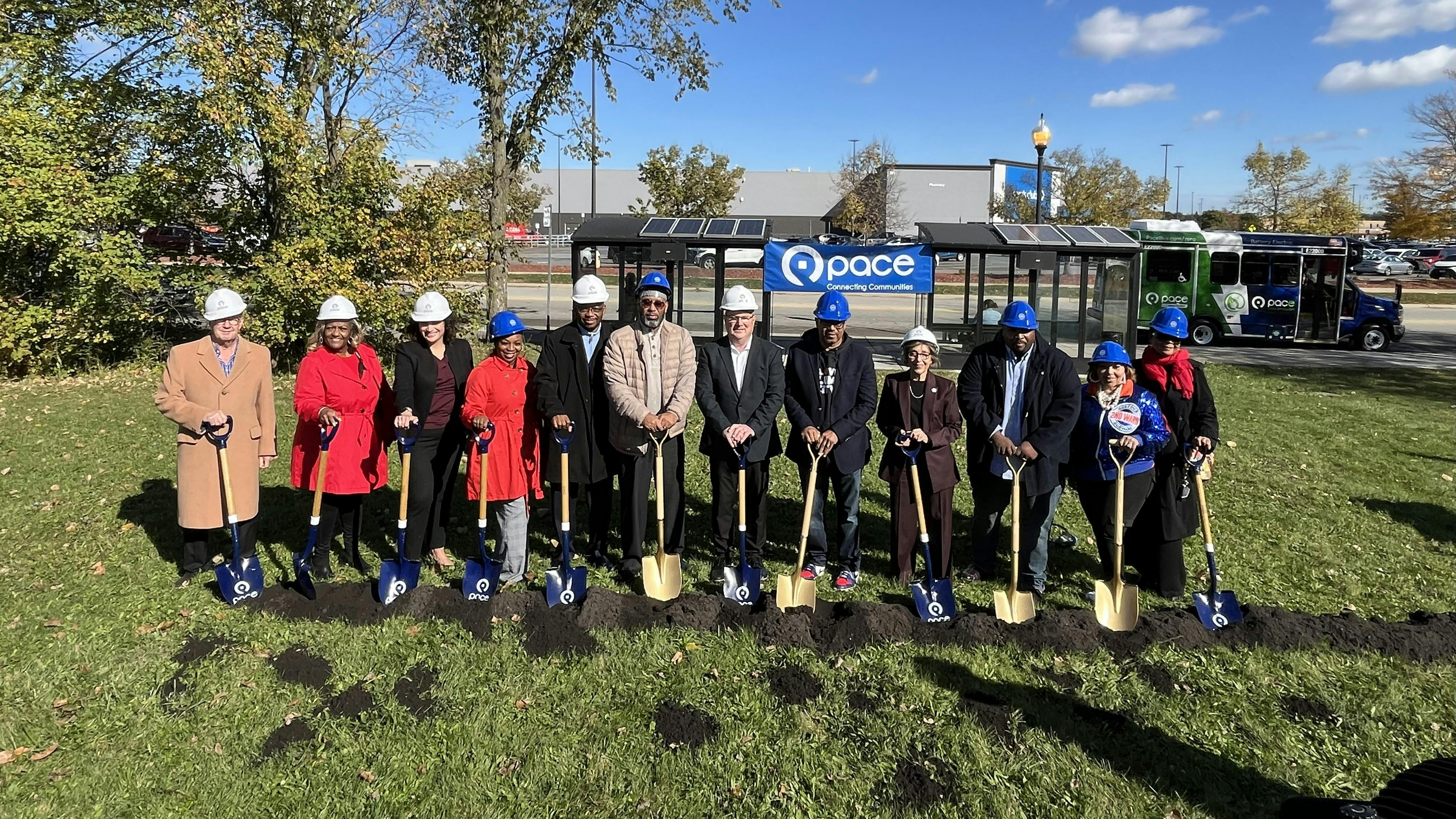Pace leadership and leaders from both local and state government insert shovels into the ground.