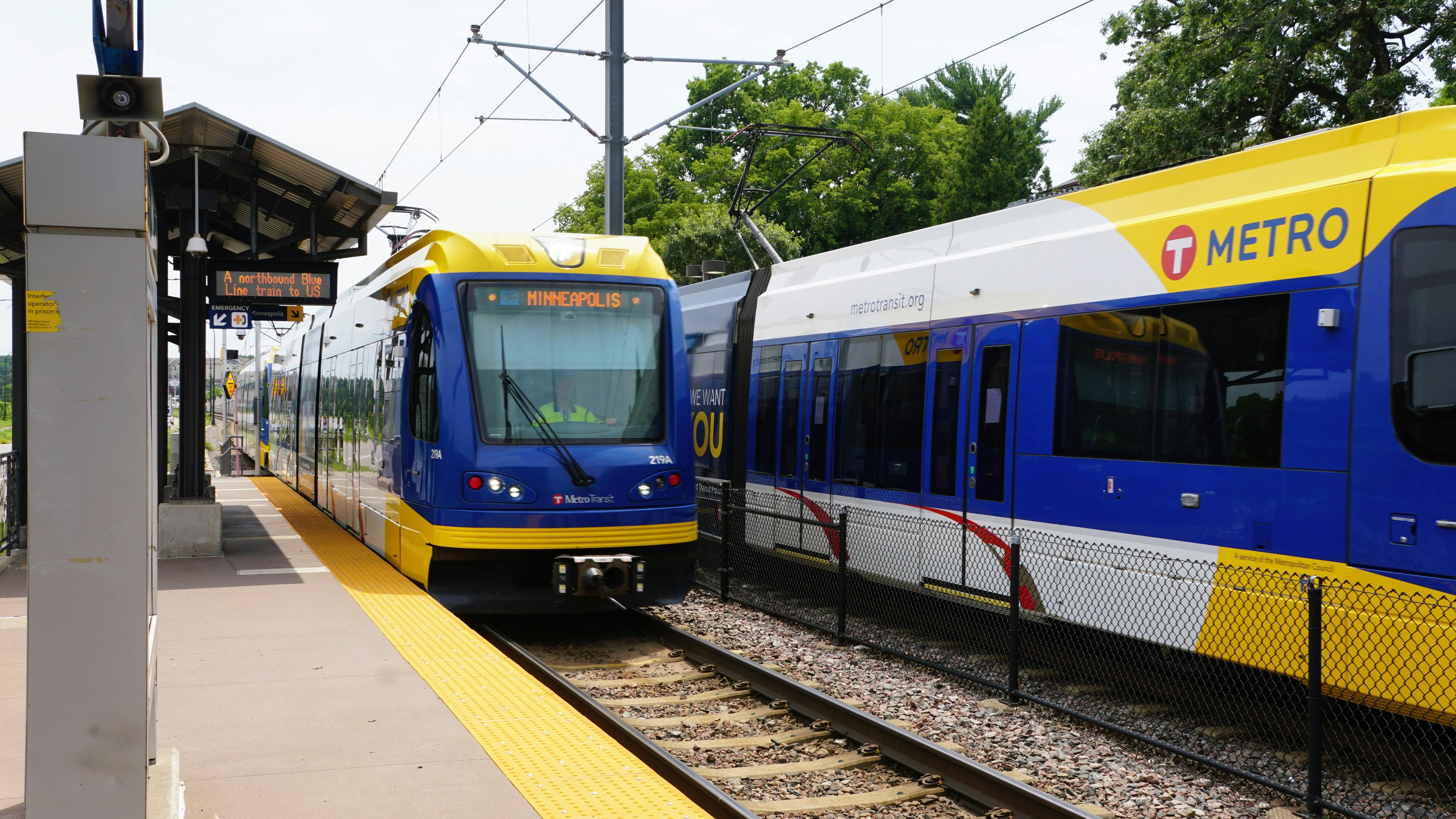 METRO trains pass through a station.