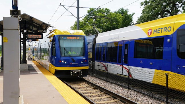 METRO trains pass through a station.