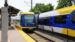 METRO trains pass through a station. METRO trains pass through a station.