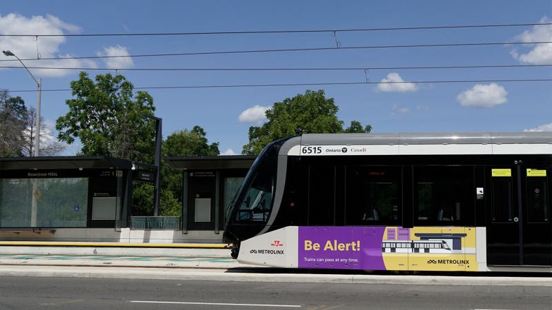 A new Metrolinx LRT car rolls down the track.