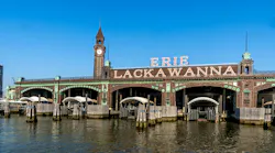 Landscape exterior view of the ferry slips of the Beaux-Arts style Hoboken Terminal, built it in 1907 by architect Kenneth M. Murchison.